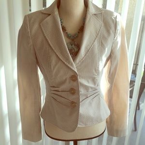 Unger fitted striped jacket and skirt suit.